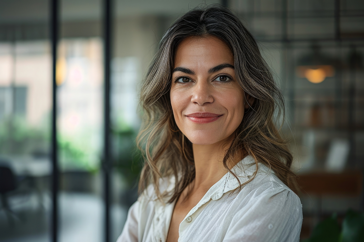 Confident smiling Latin professional mid aged elegant business woman corporate leader